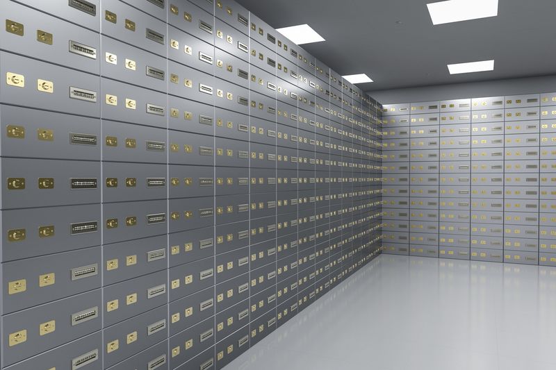 Rows of safe deposit boxes in a secure vault